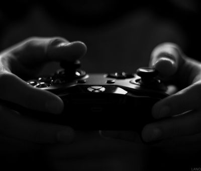 Close-up on hands gripping a dumbbell, showing focus and control.